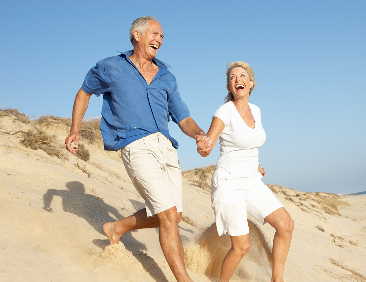 senior-couple-enjoying-beach-holiday